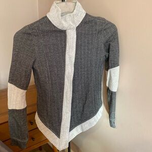 PUMA Asymmetrical zip up/snap collar herringbone jacket; size XS; grey and white